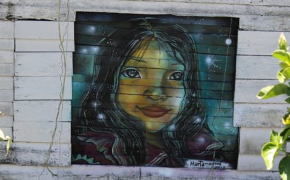 Beautiful street art and two women traveling
